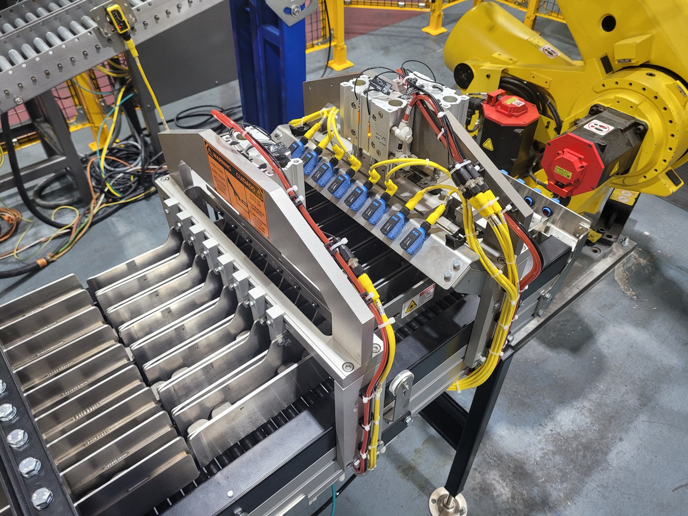 EOAT and load-rail detail used for automated part feed integration.